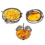 A selection of modified amber jewellery in silver and white metal mounts. To include a pendant