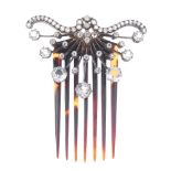 An Edwardian silver and 15ct gold white sapphire hair piece. The imitation tortoiseshell comb, to