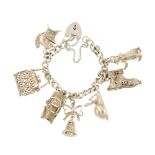 A charm bracelet. The curb-link chain with a heart-shape padlock clasp, suspending seven charms