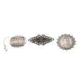 A selection of silver jewellery. To include a mid 20th century silver hinged bangle by Smith and