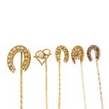 Five stickpins. Four designed as horseshoe shapes, the largest set with split pearls, one with