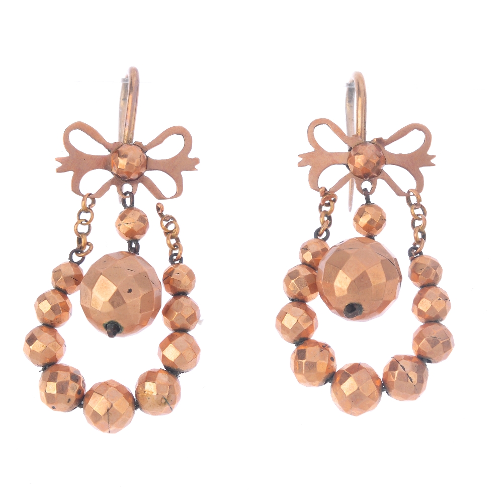 A pair of late Victorian earrings. The hook backs to the bow shapes suspending loops of faceted