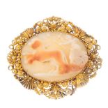 A cameo brooch. Of oval outline, the carved shell depicting a Victory riding a horse-drawn