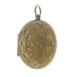 A late 19th century locket. Of oval outline with engraved decoration. Length 3.5cms.