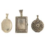 A selection of silver and white metal lockets. To include a rectangular locket with embossed foliate