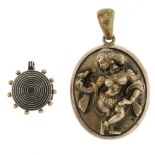 Two lockets. The first depicting a dancing figure in relief, opening to reveal two glazed panels