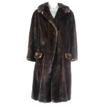 A ranch mink knee-length fur coat. Featuring a notched collar, hook and eye clip fastenings, a