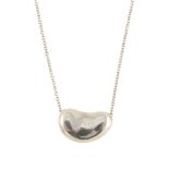 TIFFANY & CO. - an Elsa Peretti bean pendant. Designed as a bean pendant suspended on a fine