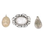 A quantity of silver and white metal jewellery. To include a pear-shape pendant with embossed scroll