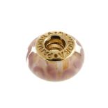 PANDORA - a gold charm. The colourless glass bead with lilac swirl patterns, to the gold inner rivet