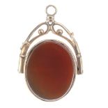 A gold swivel fob. The oval-shape fob set with bloodstone to one side and carnelian to the other,