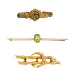 Three late 19th to early 20th century brooches. The first a bar brooch, of plain design collet-set