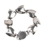 GEORG JENSEN - a bracelet. Comprising seven links each designed as abstract leaves with beaded