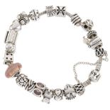PANDORA - a charm bracelet. The snake chain with eighteen charms, to include a hedgehog and a