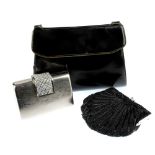 A selection of handbags. To include a black clutch bag by Jane Shilton, a black patent bag by