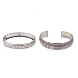 A selection of silver and white metal bangles. To include a Victorian silver hinged bangle with