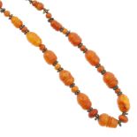 A natural amber Imam prayer bead necklace. Comprising of twenty-eight carved amber beads measuring