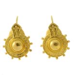 A pair of late Victorian earrings. Designed as tiered circular panels with textured border, beaded