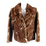 A pieced pastel mink fur jacket. Featuring a notched collar, hook and eye fastening with