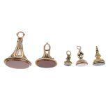 Five fobs. The first a carnelian fob of oval outline, to the petal-like pedestal, the second a small