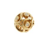 PANDORA - a gold and diamond charm. The spherical openwork bead with wave pattern set with eight