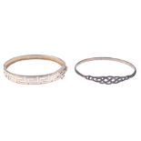 A selection of silver and white metal bangles. To include a torque bangle with basket weave