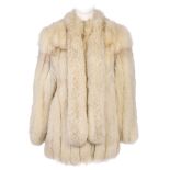 A blue fox fur coat with neck tie. Featuring a Mandarin collar with extended long thin front panels,