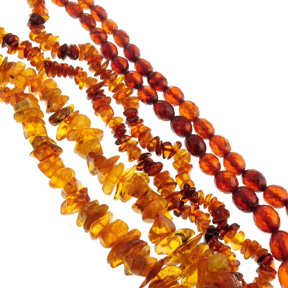 A selection of natural amber jewellery. To include four necklaces of freeform beads, one of