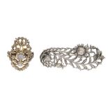 A diamond ring and diamond brooch. The brooch designed as a floral and foliate design, the flowers