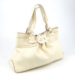 ANYA HINDMARCH - a cream leather handbag.