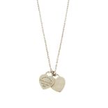 TIFFANY & CO. - a pendant. Designed as two heart panels, one reading 'Please Return To Tiffany &