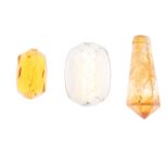 A selection of gemstones, to include citrine, together with further gemstones . Some gemstones