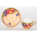 A Royal Worcester fruit painted teacup and saucer decorated by Freeman,