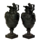 A pair of large 19th Century Wedgwood black basalt water jugs 'Sacred to Bacchus' and 'Sacred to