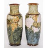 A pair of Royal Doulton stoneware vases each decorated with tubelined pink chrysanthemum flowers