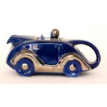 A 1930s Sadler teapot modelled as a dark blue racing car with silver lustre trims,