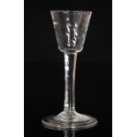 An 18th Century wine glass circa 1750, bucket bowl with diagonal basal moulding above a plain stem,