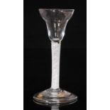 An 18th Century drinking glass circa 1765, pan top bowl above a multiple series opaque twist stem,