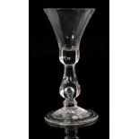 An 18th Century true baluster drinking glass circa 1720,