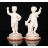 A pair of 19th Century Royal Worcester parian comport pedestals modelled as cherubs,
