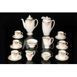 A 1930s Royal Doulton Art Deco Tango pattern coffee set in orange and black comprising coffee pot,