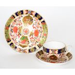 A 19th Century Derby trio decorated in the Imari palette enriched with gilded banding,