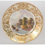 An early 19th Century Derby cabinet plate decorated to the central well with a hand-painted scene
