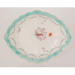 An early 19th Century Derby dish of diamond form decorated with a central hand-painted floral spray