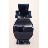 A 19th Century Chinese vase of square footed baluster form with twin tube handles,