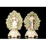 A pair of late 18th Century Chelsea - Derby figures of a farmer and his female companion,