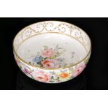 A large 19th Century Derby fruit bowl decorated to the exterior with a band of hand painted flowers