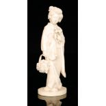 A late 19th to early 20th Century Japanese carved ivory figure of a robed geisha,