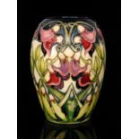 A Moorcroft Pottery vase decorated in the Sweet Pea pattern designed by Vicky Lovatt,