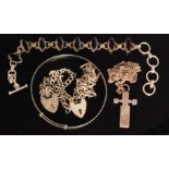 A small parcel lot of silver jewellery to include a silver cross pendant, two curb link bracelets,